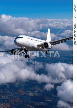 Airplane Flying High Above Clouds 126558508