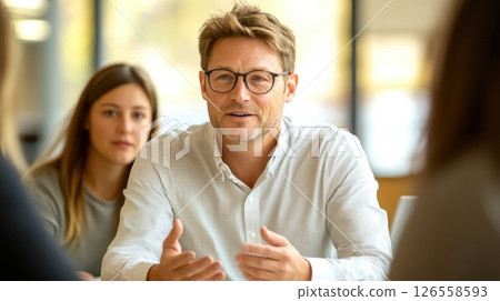 Professional Man Talking to Coworkers 126558593