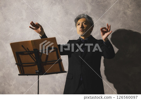 A man playing saxophone and a woman singing 126560097