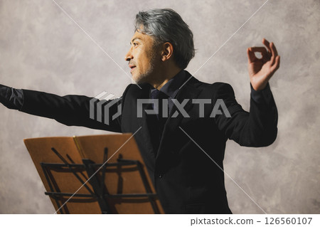 A man playing saxophone and a woman singing 126560107