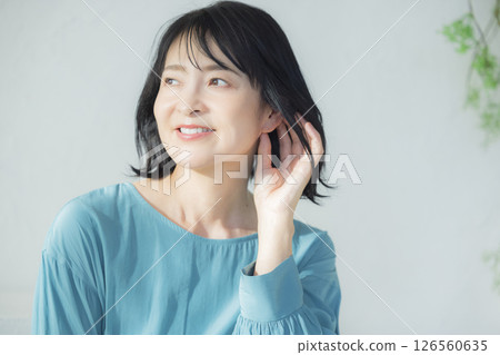 Middle-aged woman in a blue blouse 126560635