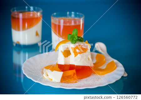 Portioned jelly dessert with yogurt cream and fruits 126560772