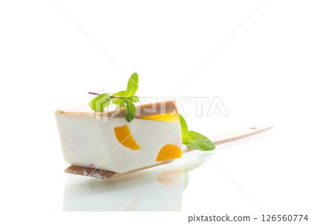 milk jelly dessert with fruit pieces milk jelly dessert with fruit pieces 126560774