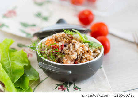 simple dinner with buckwheat and vegetables in a ceramic bowl 126560782