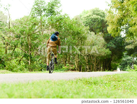 Man riding a bicycle 126561040