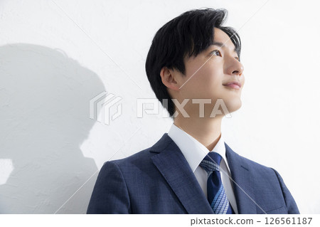 A young businessman smiling looking at the camera A young businessman smiling looking at the camera 126561187