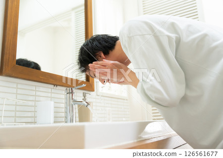 Male washing face 126561677