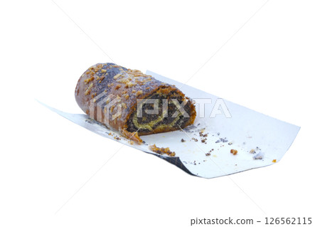 Close-up of a roll with poppy seeds, icing sugar and crushed nuts, partially eaten, on a white paper tray. Perfect for bakery advertising, food packaging and recipe blogs. No background 126562115