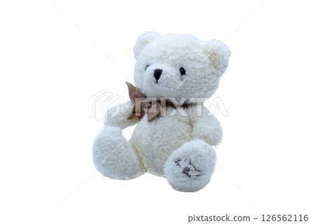 Soft white bear cub with brown ribbon sits without background. Cute plush toy for kids, baby products, gift decorating or decorating a child's room. Soft white bear cub with brown ribbon sits without background. Cute plush toy for kids, baby products, gift decorating or decorating a child's room. 126562116