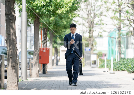 Young male business smartphone Young male business smartphone 126562178