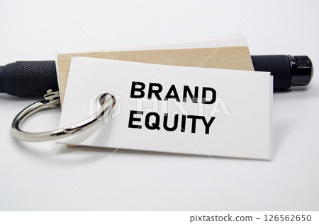 Brand equity value shown in black font on white notepad reflecting trust and brand strength. Brand equity value shown in black font on white notepad reflecting trust and brand strength. 126562650