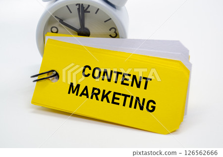 Content marketing note displayed in black over yellow for digital strategy and audience engagement. 126562666