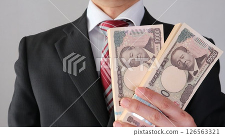 Businessman with a bundle 126563321
