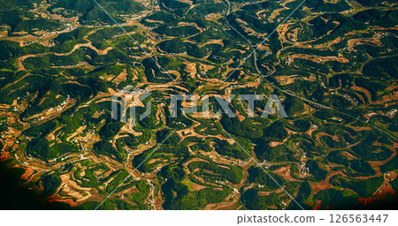 View From Airplane Window On Surroundings Of Chengdu, China. Mountainous Wooded Terrain Landscape Of China. Porthole View Or Called Bull's-eye Window. Discover China. Private Buildings 126563447