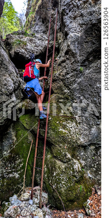 Young Woman On Via Ferrata With Ladder On Mountain Rax In The Alps In Austria 126563904