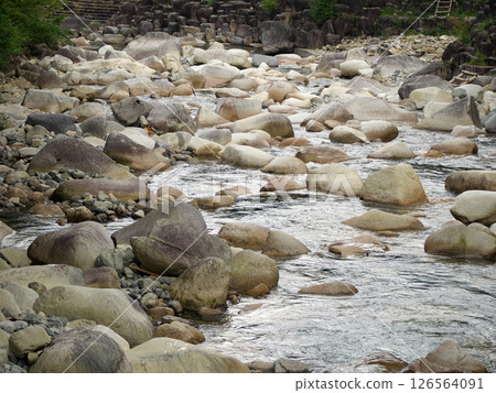 A valley stream shining in the summer sunshine 126564091