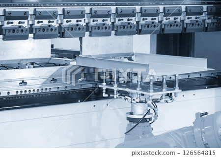 High technology bending machine operation with robotic system in the light blue scene. 126564815