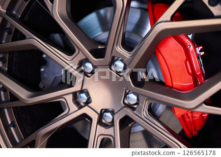 An Up Close View of a Stylish and Contemporary Car Wheel Featuring a Sporty Caliper 126565178