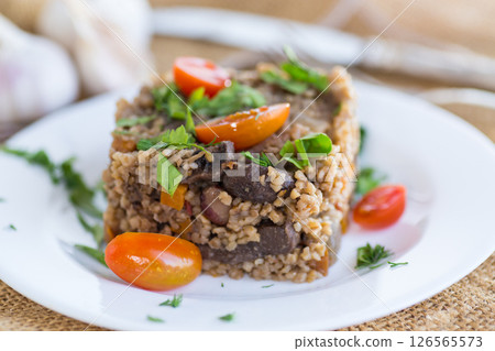 cooked dinner with bulgur and vegetables 126565573