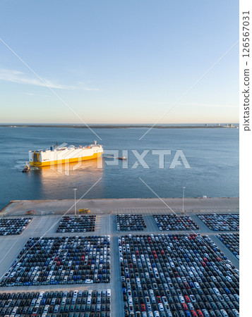 New Cars on Parking Lot and ro-ro Cargo Ship in Port of Setubal. Aerial View 126567031