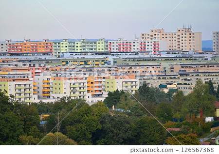 Original prefabricated houses on a housing estate from the communist era in Eastern and Central Europe after reconstruction.. Facade of a modern apartment building with windows and balconies. Czech 126567368