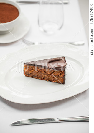 Portion of sweet chocolate cake dessert Portion of sweet chocolate cake dessert 126567498