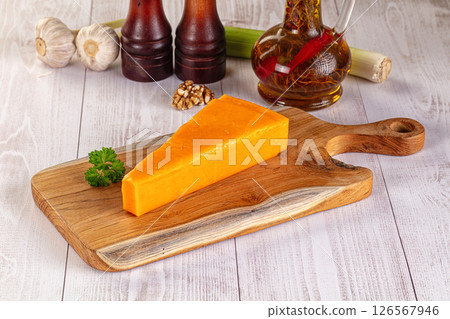 Yellow cheddae cheese over board 126567946