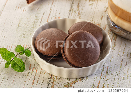 Sweet tasty almond dessert - chocolate macaroon Sweet tasty almond dessert - chocolate macaroon 126567964