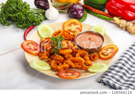 Golden fried crispy calamari with sauce 126568118