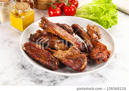 Roasted duck wings with sauce 126568120