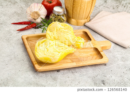 Italian traditional yellow Scamorza cheese 126568140