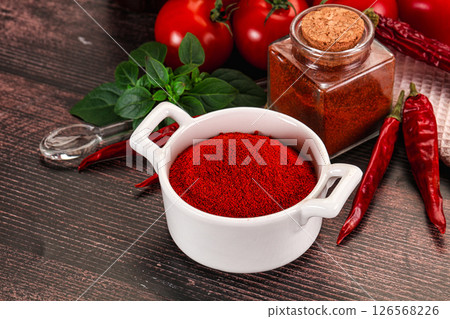 Spicy dry paprika powder in the bowl Spicy dry paprika powder in the bowl 126568226
