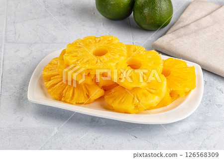 Sweet canned pineapple slices in syrope Sweet canned pineapple slices in syrope 126568309