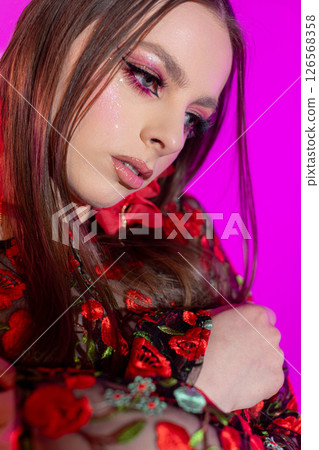 A Fashion Portrait featuring Beautiful Floral Elements combined with Bold, Creative Makeup 126568358