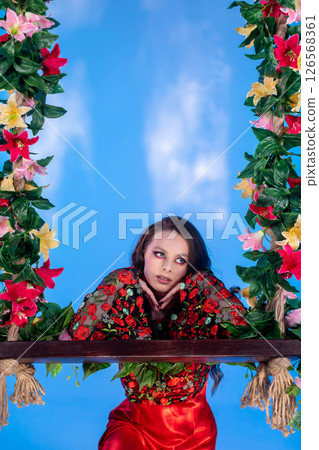 A Colorful Portrait Featuring a Model Surrounded by Beautiful Floral Decorations and Accents A Colorful Portrait Featuring a Model Surrounded by Beautiful Floral Decorations and Accents 126568361