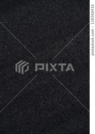 Background of porous foam rubber. Black foam rubber. Packaging material. 126568416