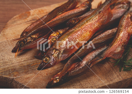 cold smoked capelin, on a wooden chopping board, no people, 126569154