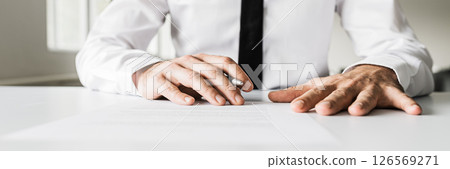 Business manager signing document Business manager signing document 126569271
