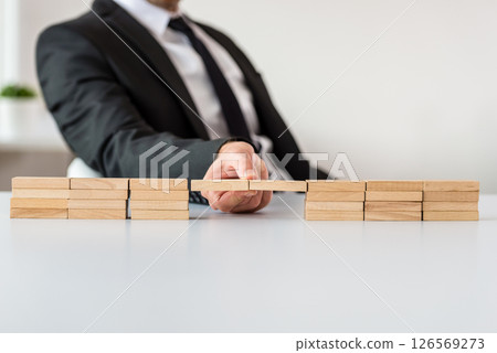 Conceptual image of business merger Conceptual image of business merger 126569273