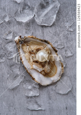 Oyster with the pearl on gray background 126569423