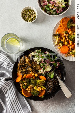 A balanced breakfast bowl with black quinoa, avocado, roast chicken, and sweet potatoes, topped with a fresh cabbage and radish salad A balanced breakfast bowl with black quinoa, avocado, roast chicken, and sweet potatoes, topped with a fresh cabbage and radish salad 126569535