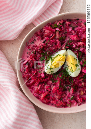 Summer cold beetroot soup made from beets, radishes, cucumbers, potatoes and herbs 126569552