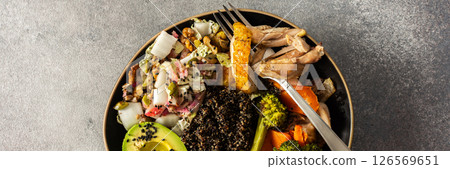 A vibrant, protein-packed breakfast with black quinoa, avocado, chicken, roasted veggies like sweet potato, broccoli, and a fresh salad of cabbage, radish, chia, and sesame seeds, banner A vibrant, protein-packed breakfast with black quinoa, avocado, chicken, roasted veggies like sweet potato, broccoli, and a fresh salad of cabbage, radish, chia, and sesame seeds, banner 126569651