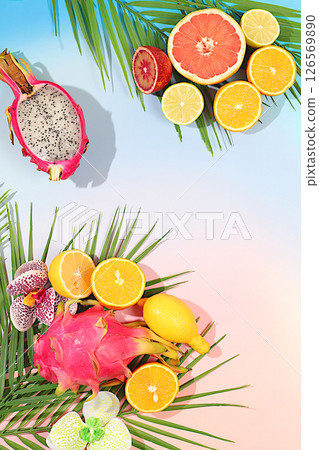 Dragon fruit, pitaya, oranges, lemons, orchid flowers on palm leaves, tropical background with palm trees and exotic fruits, beautiful template for your design, bright sunny banner, in a snapshot. Dragon fruit, pitaya, oranges, lemons, orchid flowers on palm leaves, tropical background with palm trees and exotic fruits, beautiful template for your design, bright sunny banner, in a snapshot. 126569890