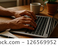 Laptop Typing in Home Office 126569952