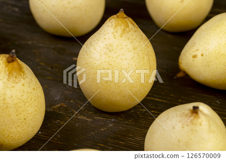sweet pears of white color with spots on the skin closeup 126570009