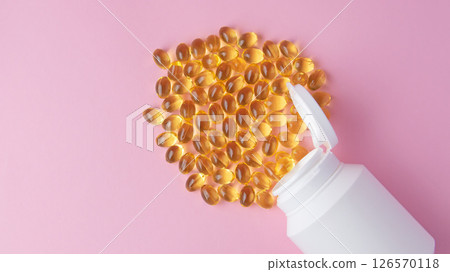Vitaminen Omega 3 oil in capsules on pink background. Much medical pills and drugs in white plastic bottle. Healthcare concept. 126570118