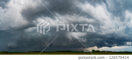 storm cloud rolling over the field. Climate change Conference storm cloud rolling over the field. Climate change Conference 126570424