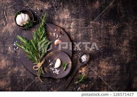 Rosemary, garlic, salt and pepper. Rosemary, garlic, salt and pepper. 126571427
