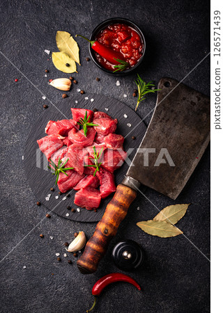 Raw beef meat and ingredients for cooking 126571439
